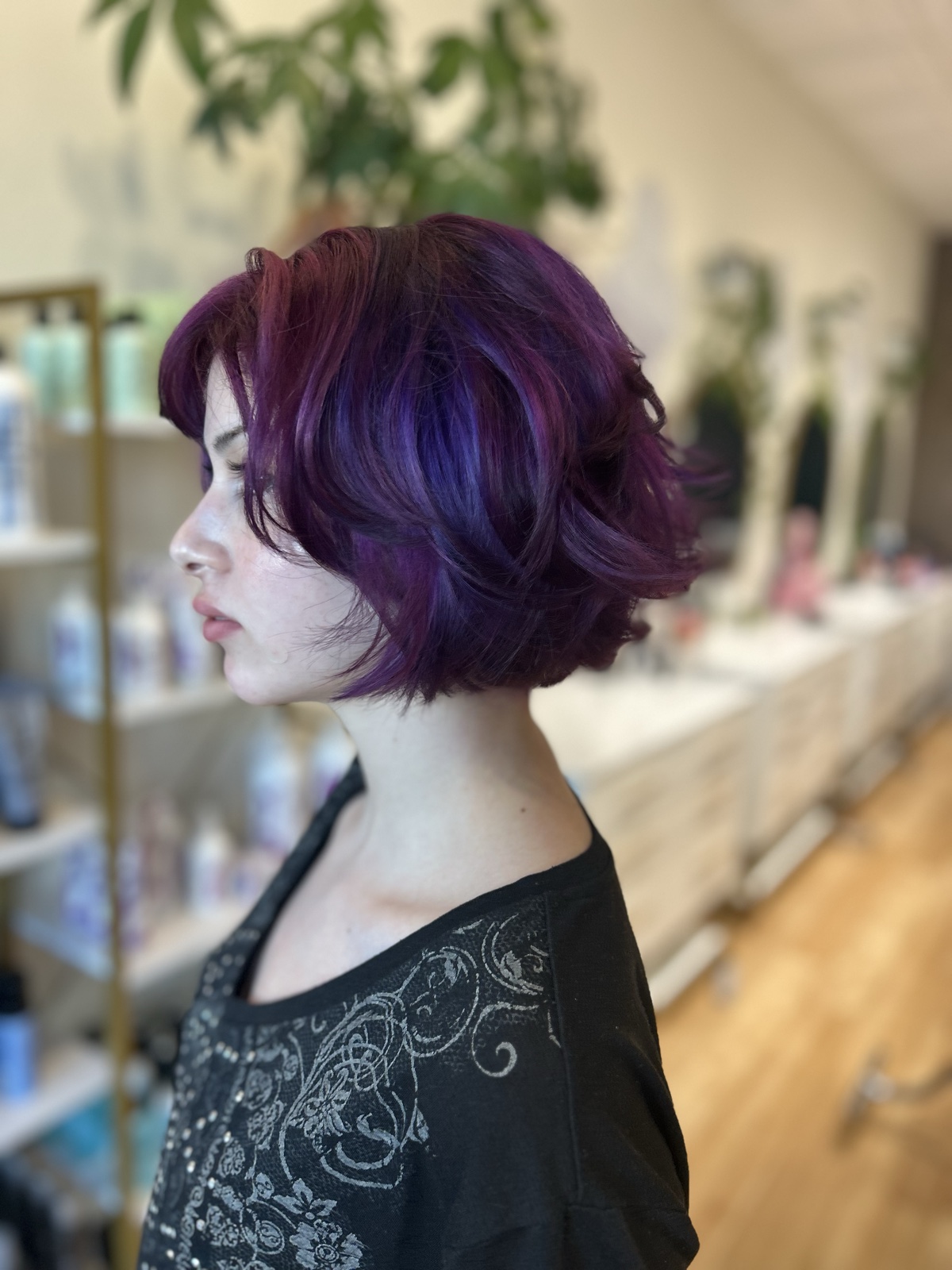 Vivid purple and violet color on a short, textured bob, in profile. Vivid color by Tori Knox at Canterbury & Co. Salon in Fort Myers