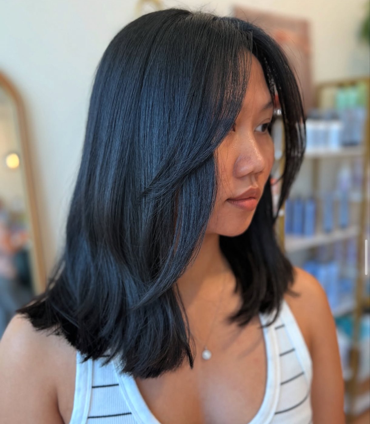 A glossy black precision-cut lob from the Canterbury & Co. salon floor in Fort Myers.