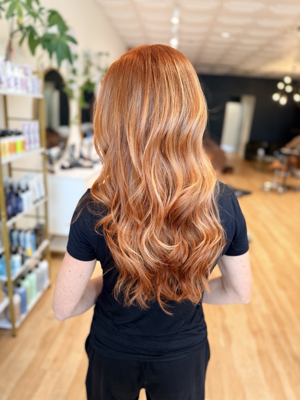 Copper balayage with dimensional, face-framing brightness — color by the Canterbury Color Team in Fort Myers.