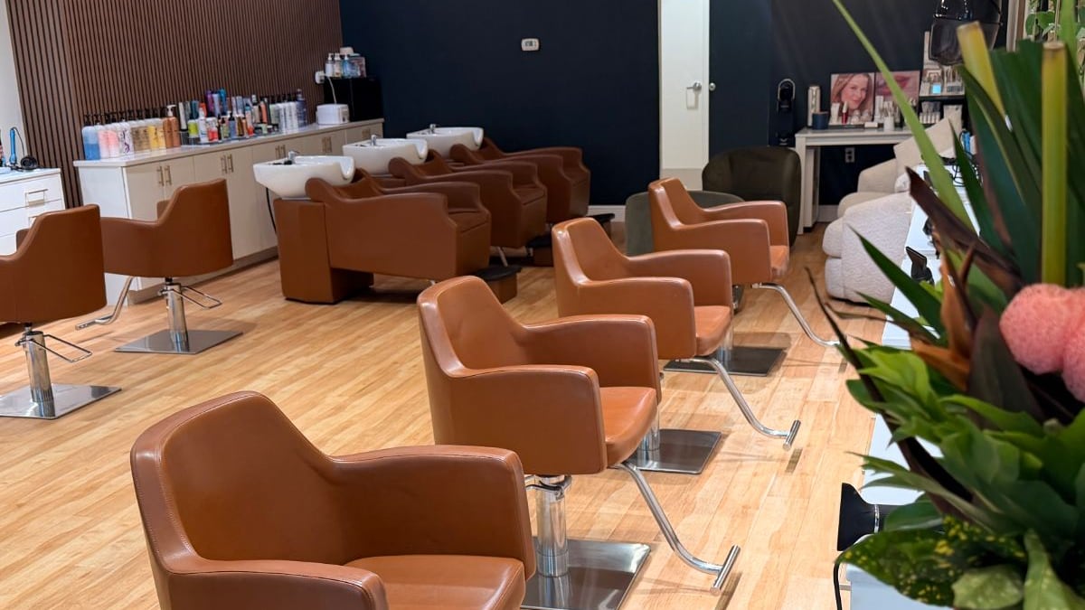 The working floor at Canterbury & Co. in Gulf Coast Town Center, Fort Myers: styling chairs, backwash stations and the product shelves